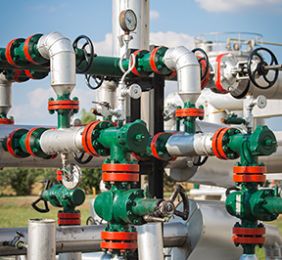 Wellhead control system with valves and pressure regulators for oil and gas pressure management